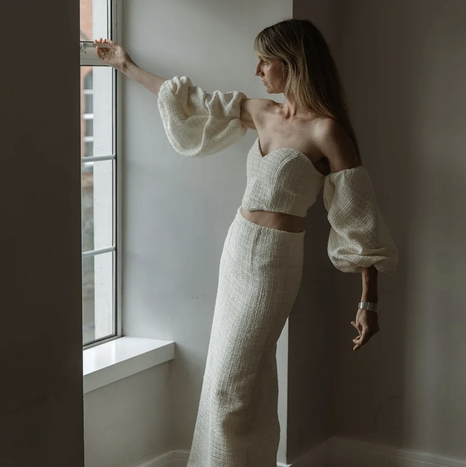 Studio Nora three-piece bridal ensemble with corset top, puff sleeves and skirt