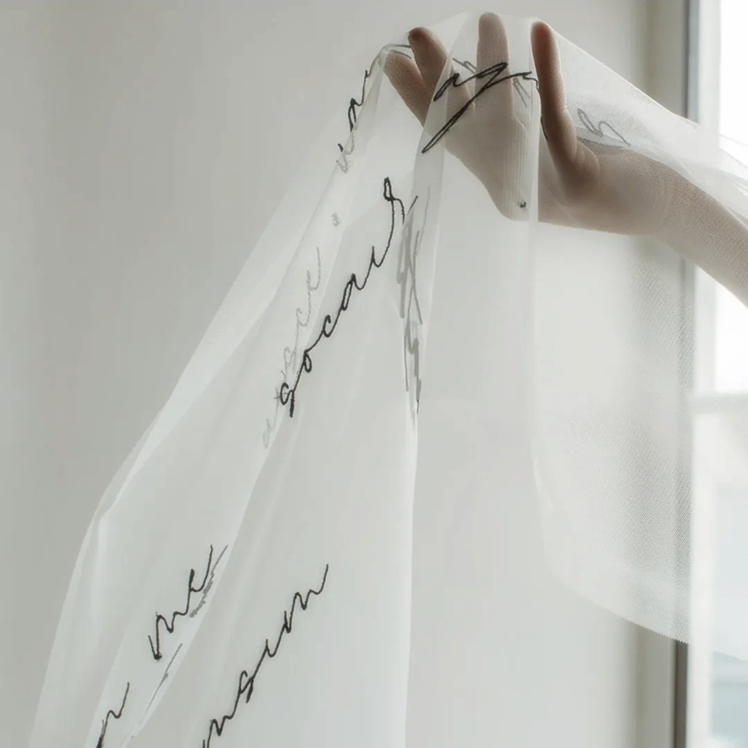 Personalised embroidery on soft bridal fabric by Studio Nora